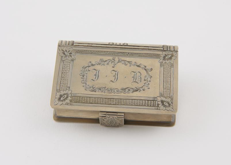 Snuff box in book form with hinged lid and clasp, white metal