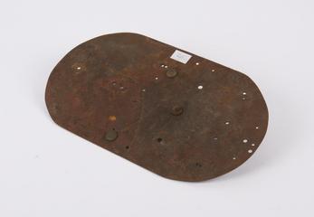 Metal oval with stud on base