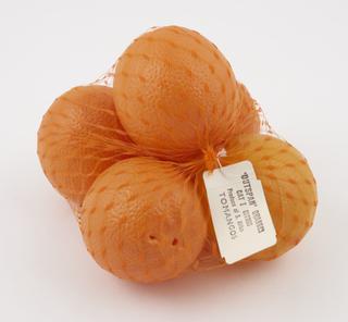 Netlon bag containing imitation oranges