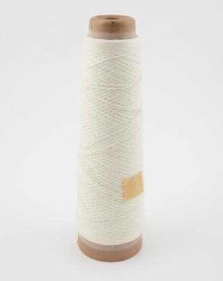 Chain warp yarn used in Axminster carpet manufacture