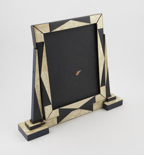 Photograph frame on swing base decorated with geometric design