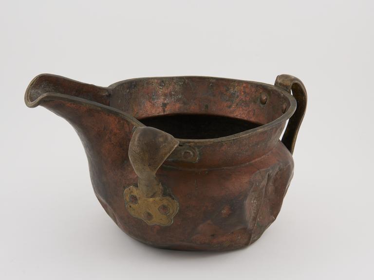 Large wide-necked copper jug or ewer with two brass handles