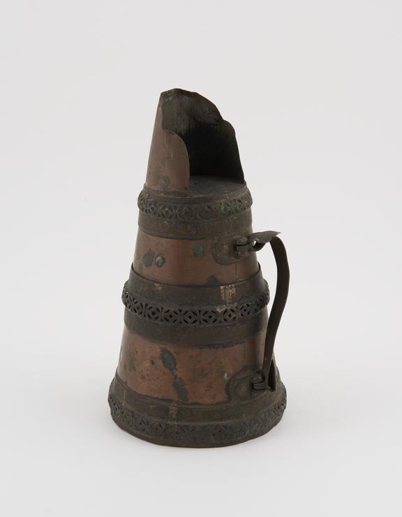 Copper libation jug with side-swing handle and raised lip