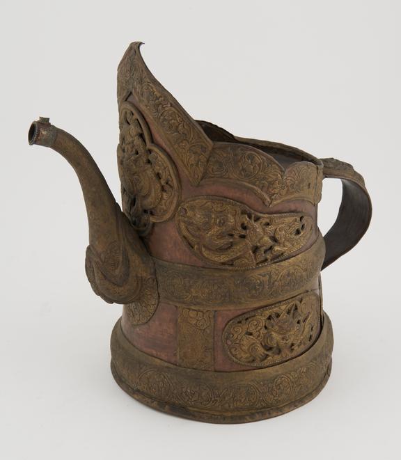 Large copper jug with sectioned hinged lid, handle and spout