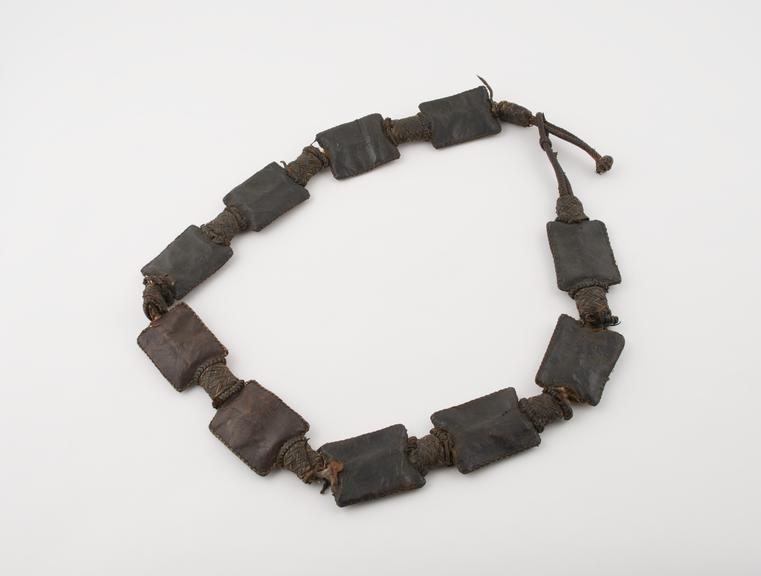 Leather amuletic belt, comprising ten rectangular amulet cases