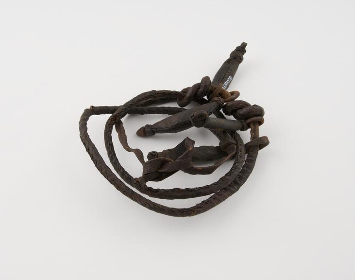 Amuletic necklace of 4 claw-like iron pendants encased in