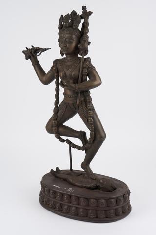 Statue of female Buddhist deity with skull necklace