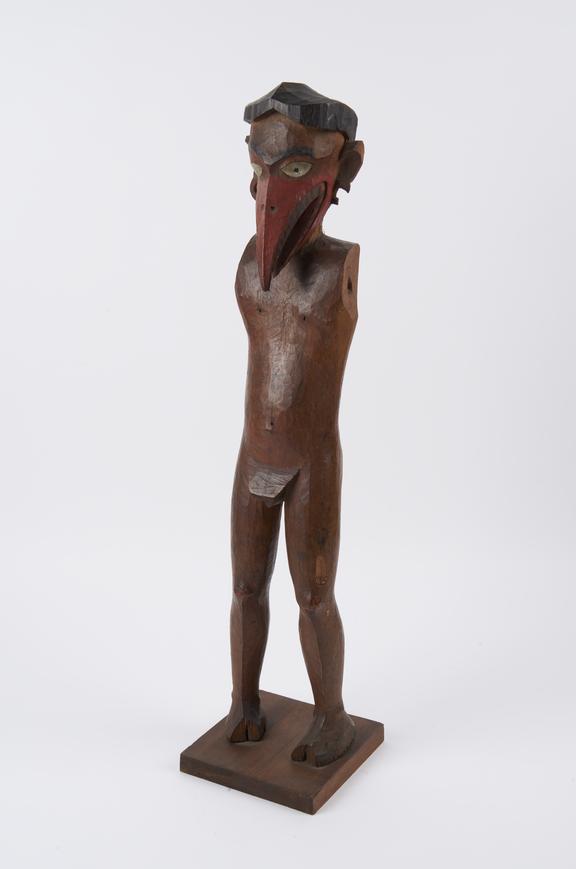 Wooden statue stylised bird head, body of a man