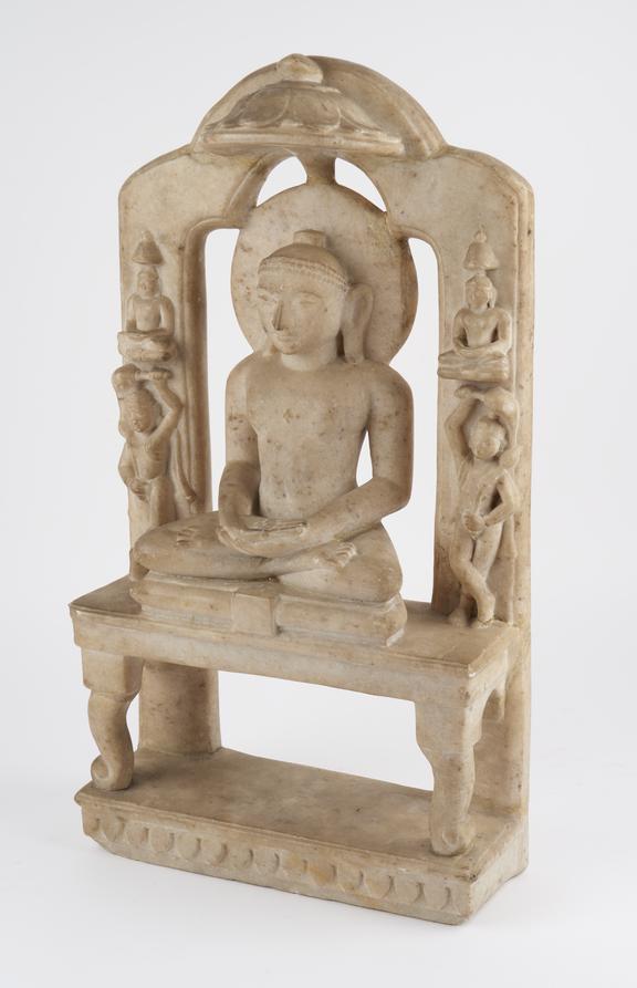 Marble carving of Vardhamana flanked by saints, from West India