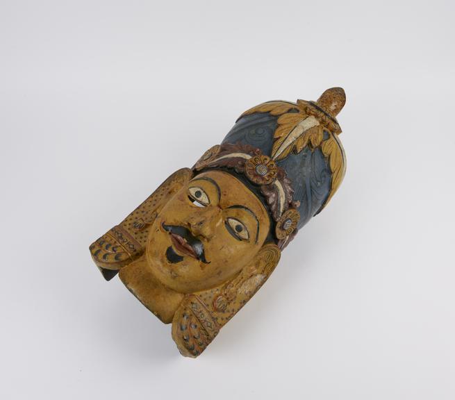 Painted wooden mask, polychrome, probably representing Raja