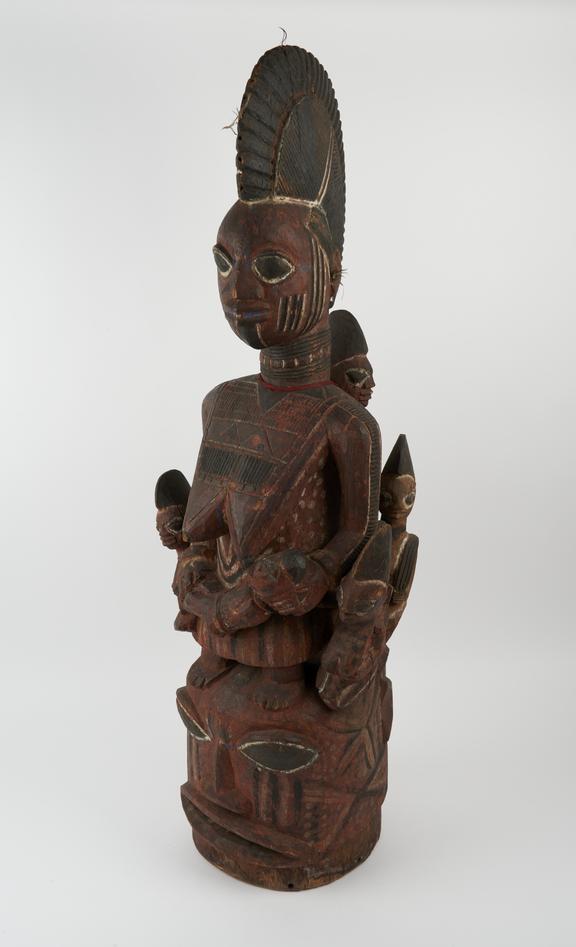 Carved wooden polychrome mask with superstructure of female