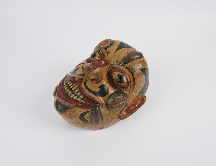 Painted wooden face-mask, from the kolam masked play