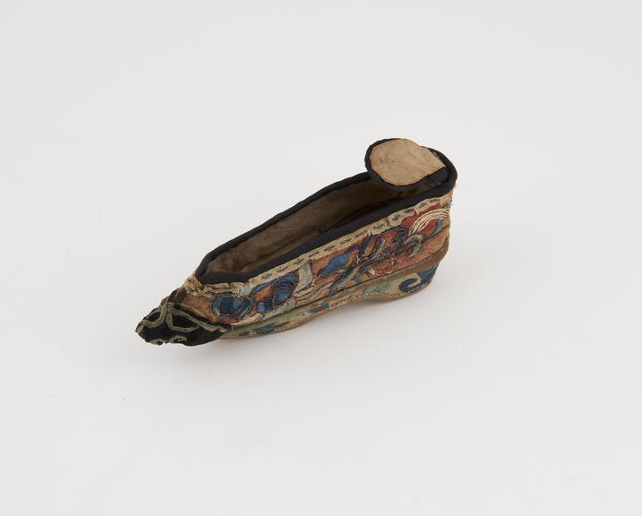 Shoe, one of a pair for bound feet, red silk material