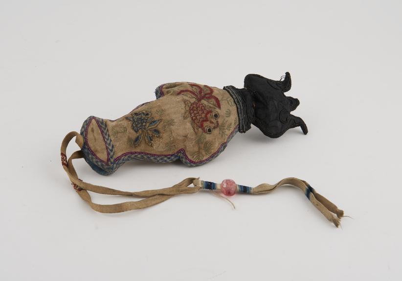 Cloth needle holder(?) in the form of a fish, black silk head