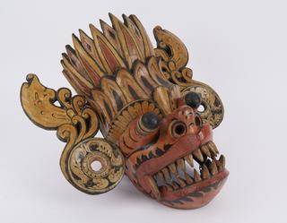 Poluchrome mask representing Maru Rassa from Kolam play