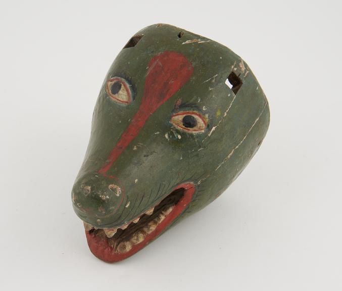 Painted wooden mask, in form of animal's head, ears missing