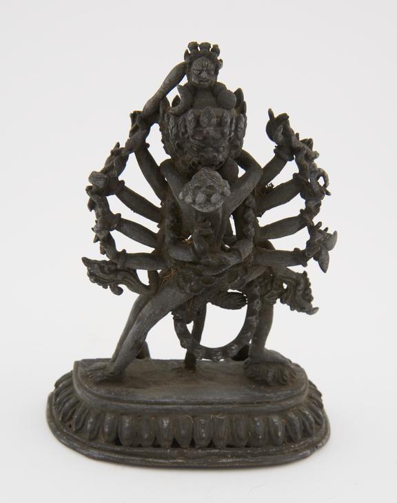Bronze buddhist statue, many armed copulating devil, Tibetan