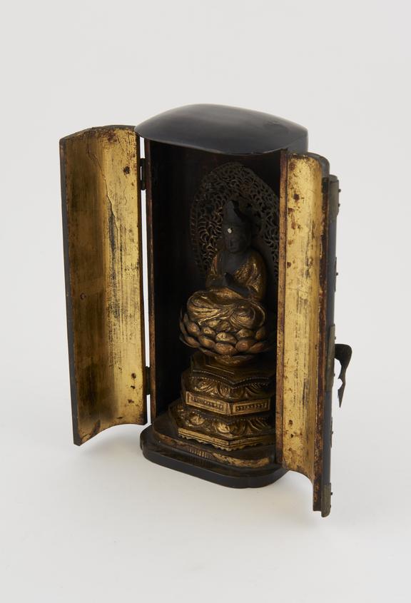 Oval wooden shrine with hinge doors