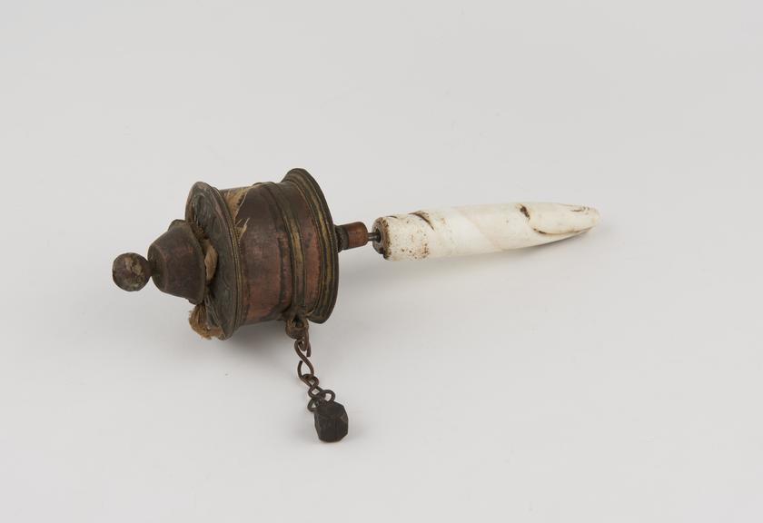 Copper and brass hand prayer wheel with shell handle