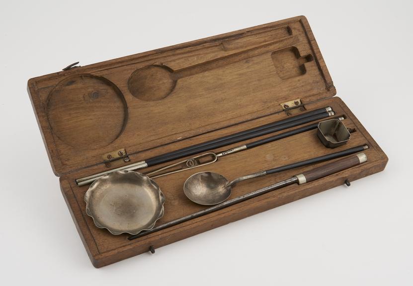 Cutlery set in rectangular wooden case, comprising chopsticks