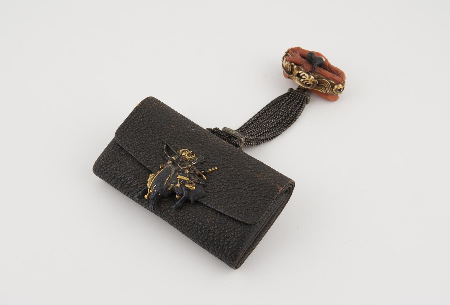 Tobacco pouch which is joined to a netsuke via a bunch of small link chains