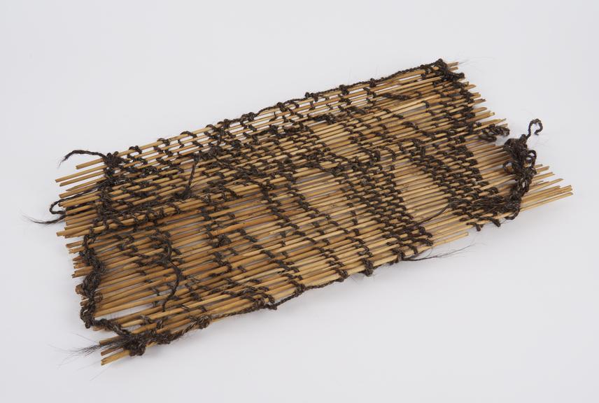 Arm splint, in the form of reeds lashed together with cord