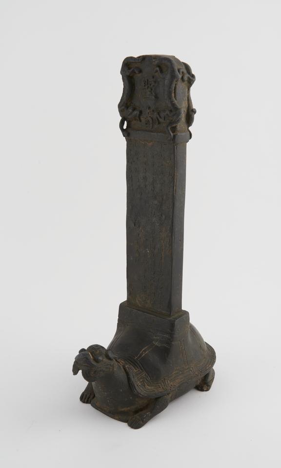 Bronze funerary tablet mounted on tortoise base