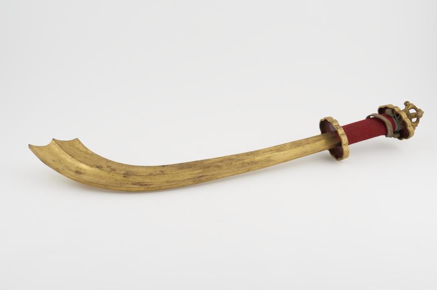 Ritual curved sword of gilt copper, with dorge finial