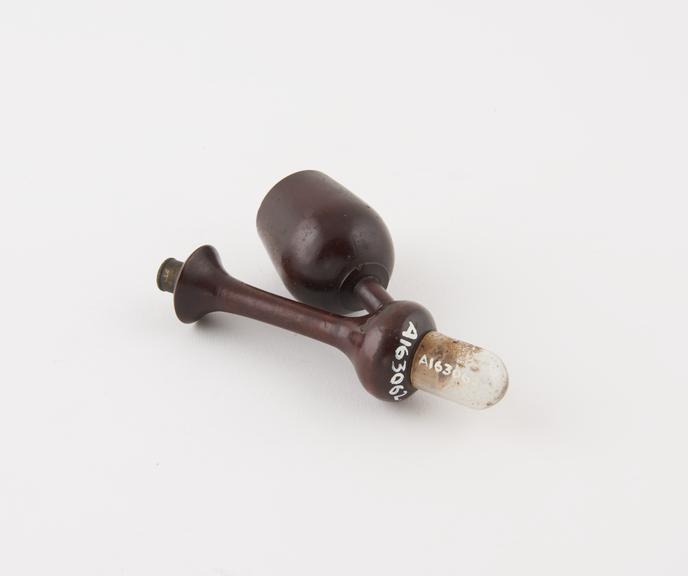 Wooden tobacco pipe with glass exterior and carved stem