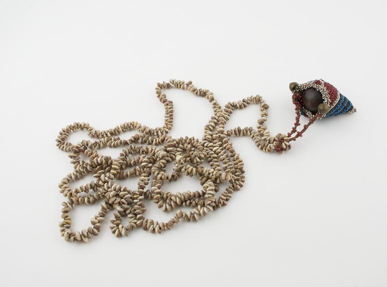 Cowrie shell necklace with fine beadwork bag suspended