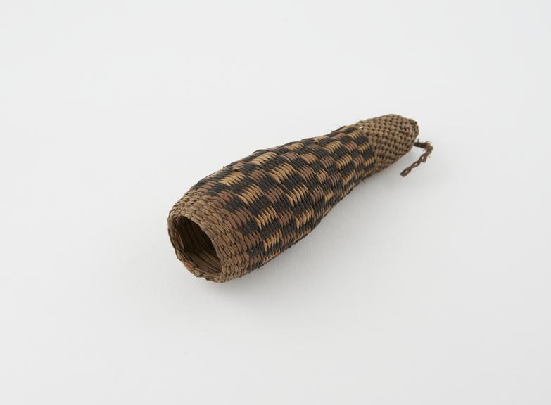 Penis sheath made from fine grasses and constructed in