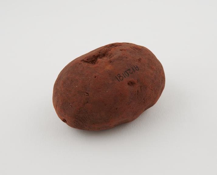 Oval lump of camwood powder, coagulated mass