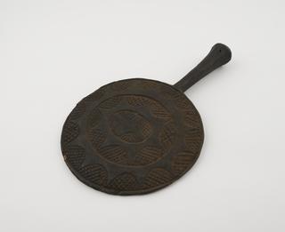 Wooden fan called a "Nku Abia"