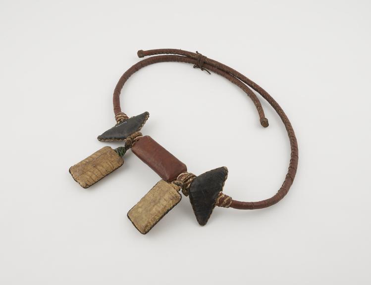 Amuletic girdle of leather with rectranular and triangular