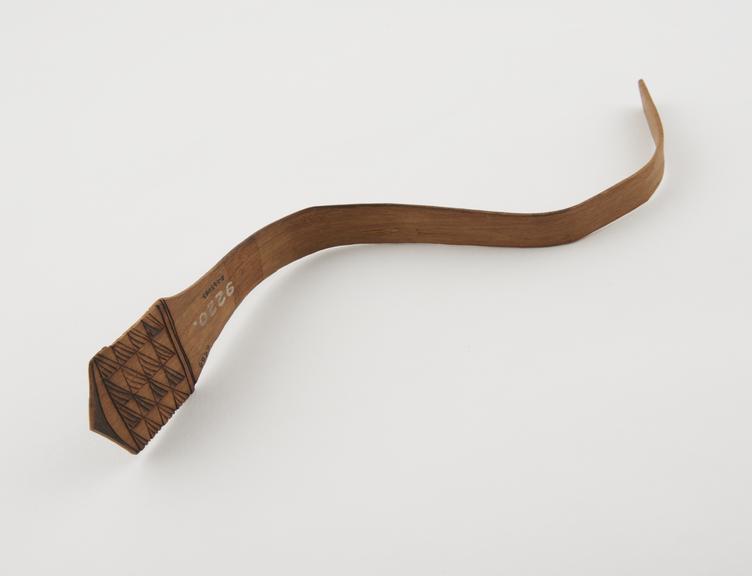 S'-shaped cane strigil, with burnt decoration, Nigerian'