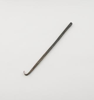 Steel(?) rod tapering to flattened sharpened hook,