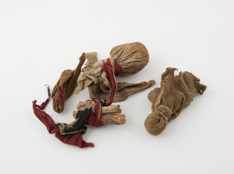 Collection of rag bundles and twigs from medicine man's outfit