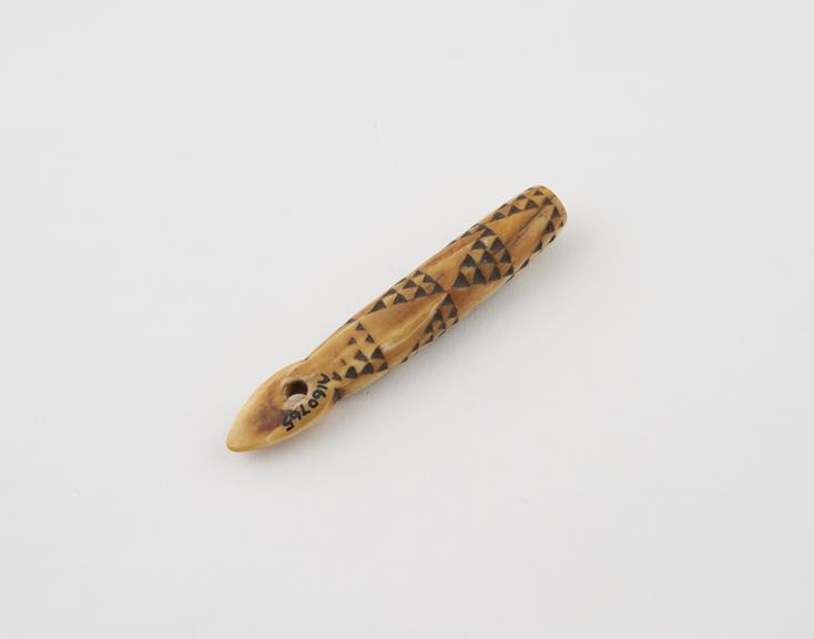 Small tubular ivory Amulet, with loop at top for suspension