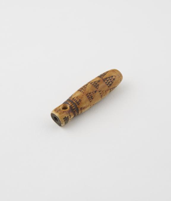 Small tubular ivory amulet, hole for suspension at top