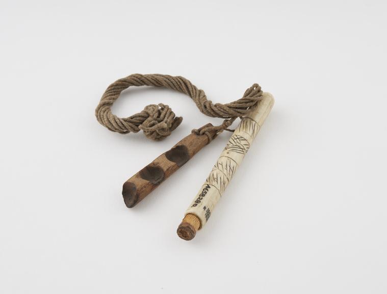 Amulet of bone cylinder and female hearth of fire sticks