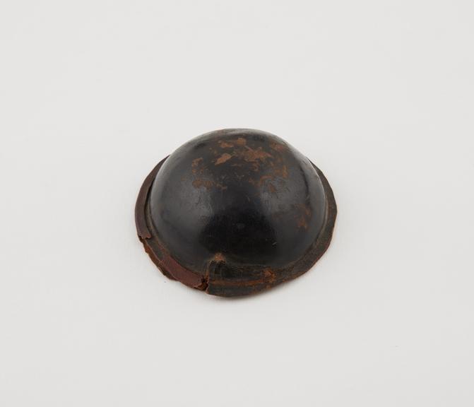 Leather covered, button shaped amulet, Sarakolle, Senegal