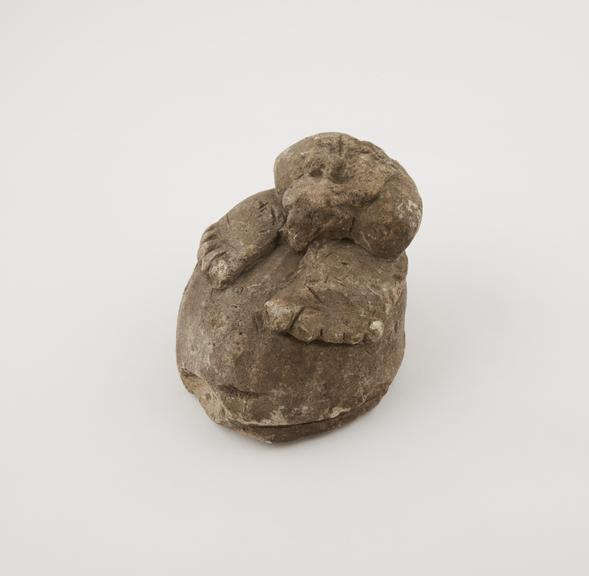 Nomoli figure representing human feet and phallus on