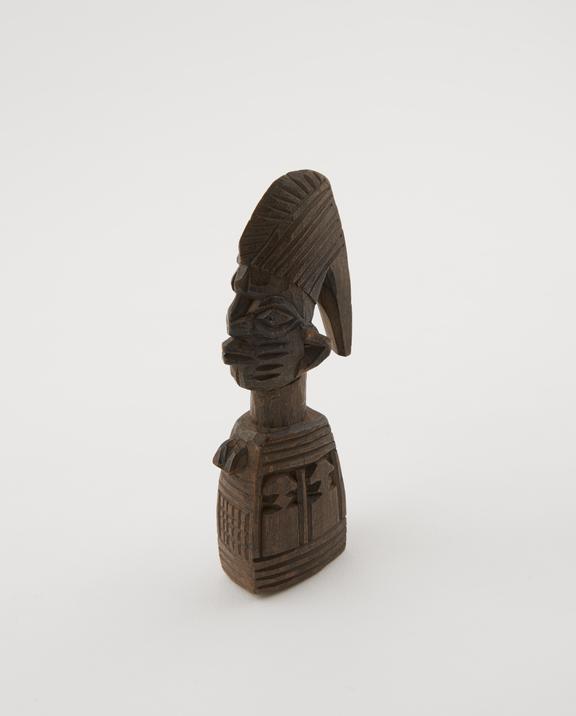 Amulet consisting of carved wooden effigy of Eshu with hooked