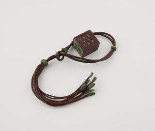 Amuletic bracelet, leather, with geometric designs