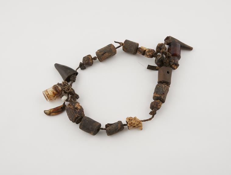 Amuletic necklace consisting of two small glass bottles