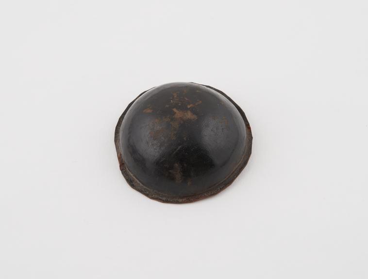 Button shaped amulet of leather, Sarakolle tribe, West Africa