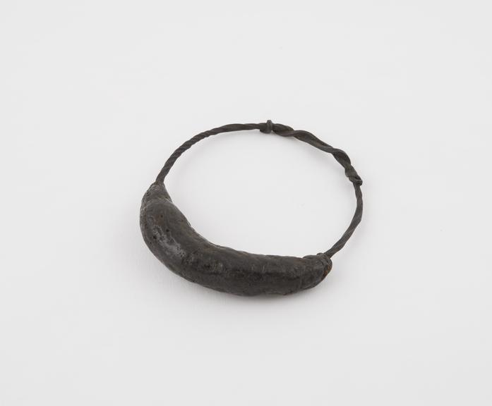 Amuletic bracelet of twisted iron partially covered with