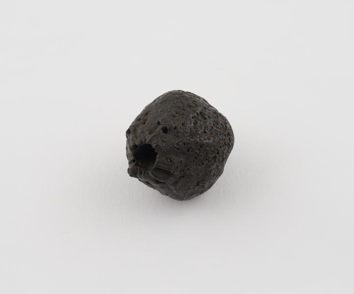 Perforated nut probably part of rattle and amuletic