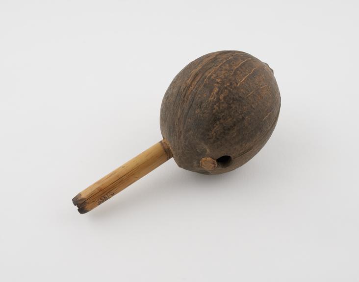 Hemp pipe, coconut shell reservoir with bamboo stem inserted