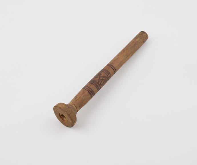 Wooden tube with conical finial, possibly a drinking tube